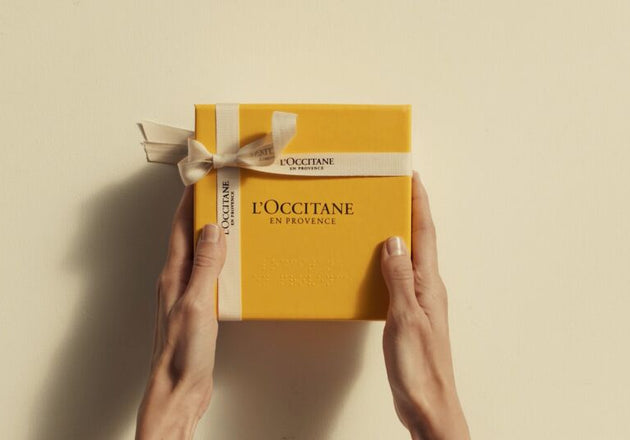Желтая подарочная коробка с лентой L'Occitane